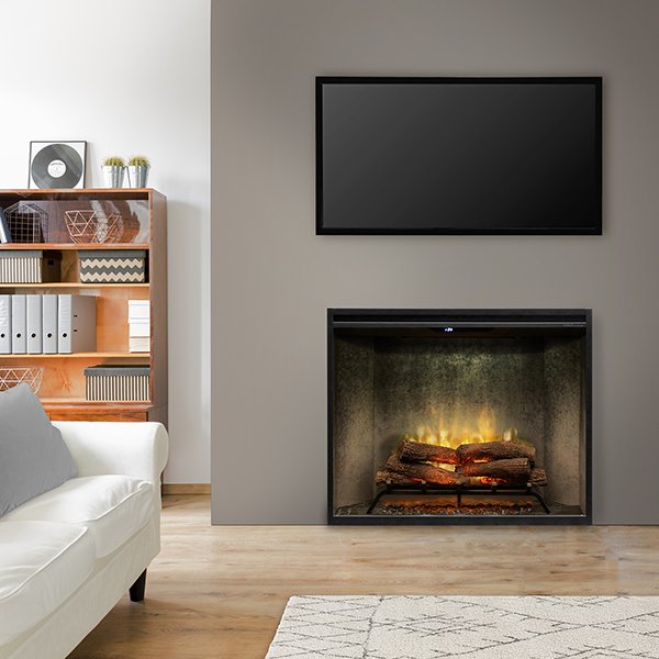 close up view of a modern electric fireplace lit with a tv above the fireplace