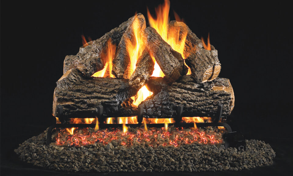 a close up view of the charred gas log fireplace
